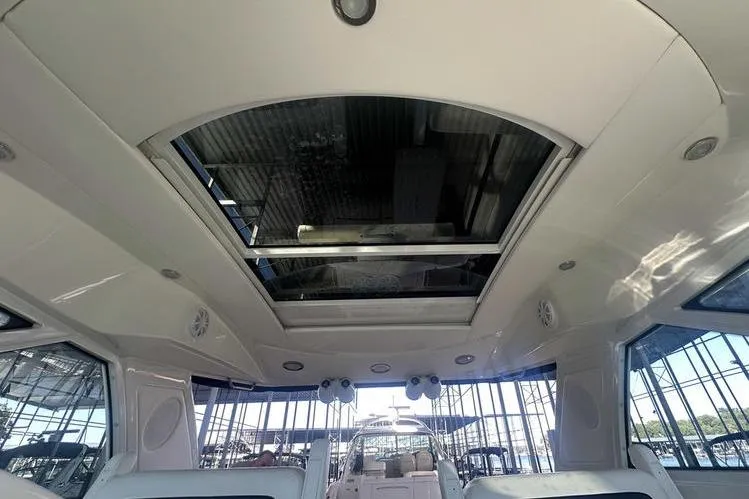 Slide: The Image of Interior view of 2010 Sea Ray 450 Sundancer yacht with sunroof and modern design. - 9