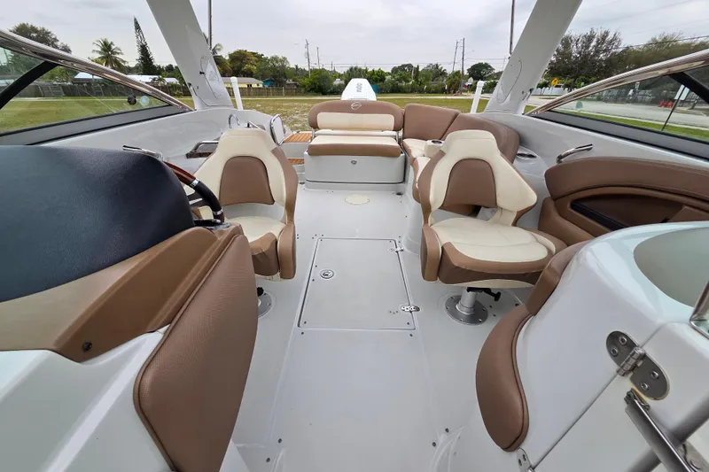 Slide: The Image of 2019 Crownline Eclipse E275 XS boat interior with luxurious seating and modern design. - 5