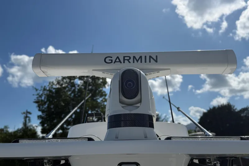 Slide: The Image of 2024 SeaHunter 35 Tournament boat with Garmin radar against a clear blue sky. - 14