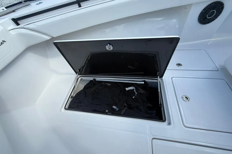 Slide: The Image of Open storage compartment on 2024 SeaHunter 35 Tournament boat deck. - 19