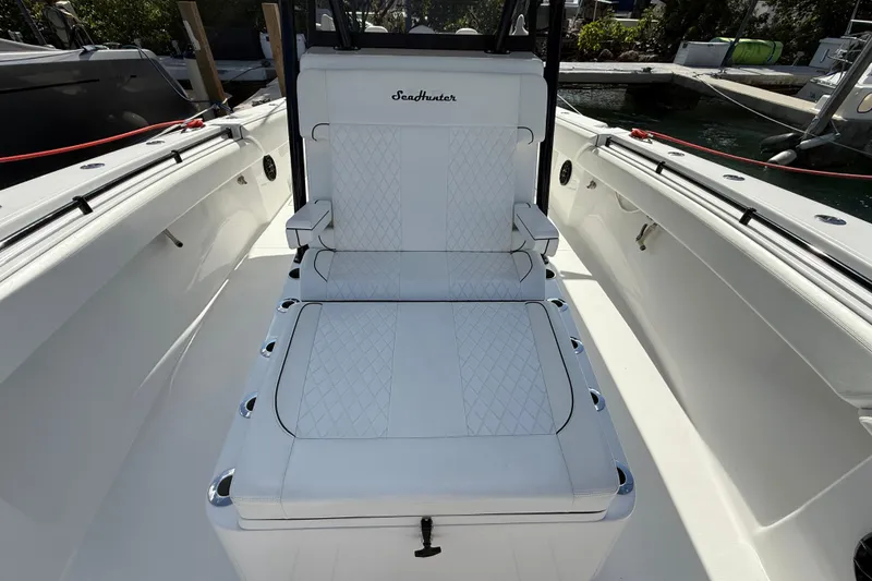 Slide: The Image of 2024 SeaHunter 35 Tournament boat interior with white cushioned seating. - 23