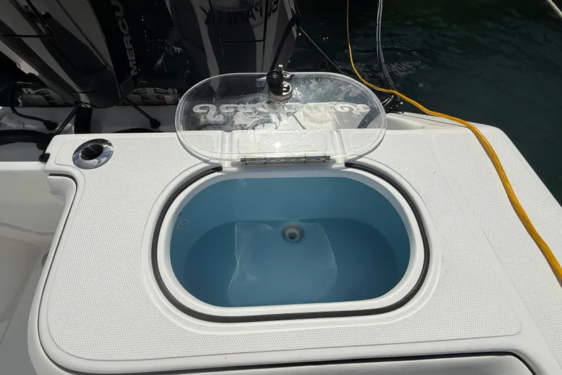 Slide: The Image of 2024 SeaHunter 35 Tournament boat livewell with open lid, showcasing interior design. - 25