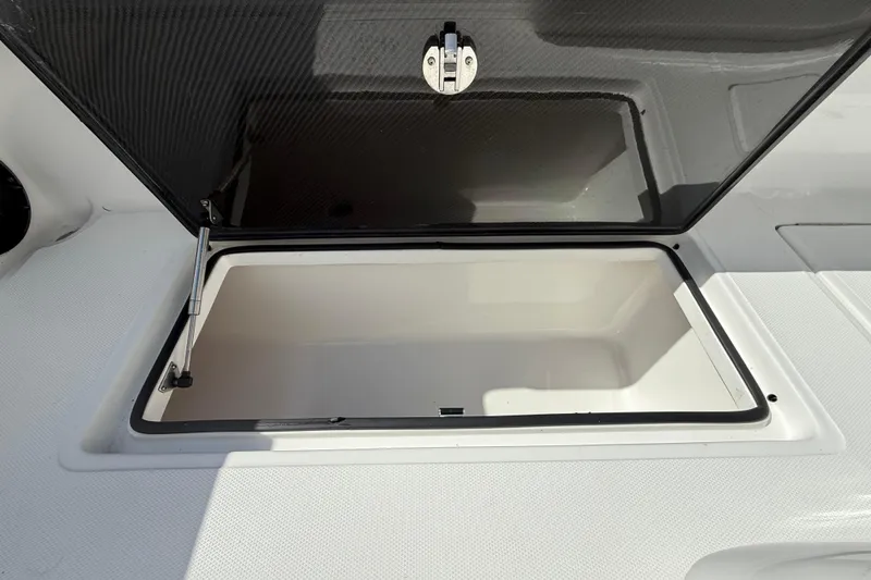 Slide: The Image of Open storage compartment on 2024 SeaHunter 35 Tournament boat. - 26