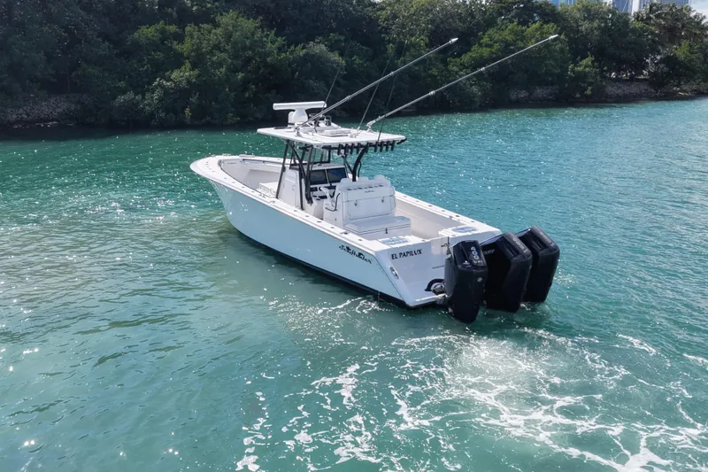 Slide: The Image of 2024 SeaHunter 35 Tournament boat on clear blue water, featuring dual outboard engines. - 3