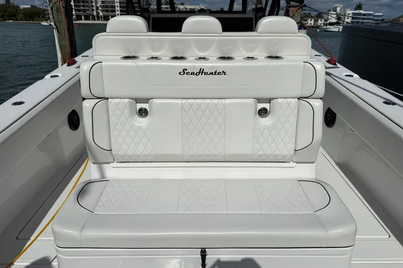 Slide: The Image of 2024 SeaHunter 35 Tournament boat with luxurious white seating and diamond stitching. - 32