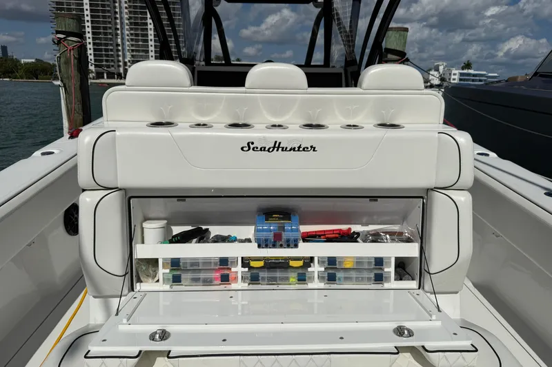 Slide: The Image of 2024 SeaHunter 35 Tournament boat with open storage compartment, showcasing organized fishing gear. - 33