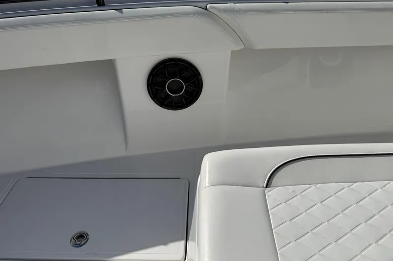 Slide: The Image of 2024 SeaHunter 35 Tournament boat interior with speaker and cushioned seating. - 35