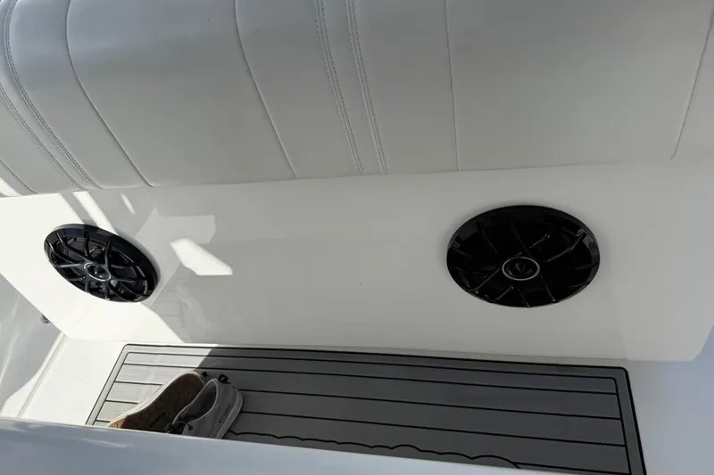 Slide: The Image of 2024 SeaHunter 35 Tournament boat interior with speakers and shoes on deck. - 38
