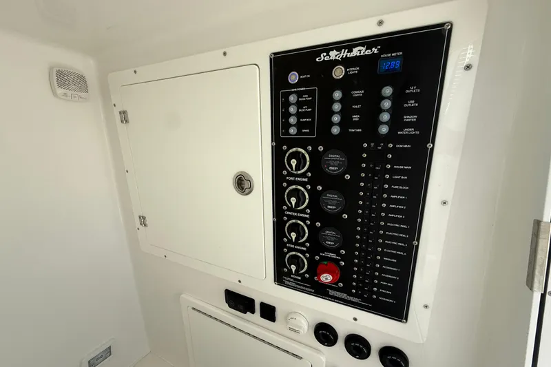 Slide: The Image of Control panel of 2024 SeaHunter 35 Tournament boat, featuring various switches and meters. - 41