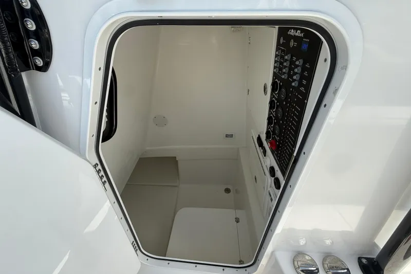 Slide: The Image of 2024 SeaHunter 35 Tournament boat interior with control panel and storage space. - 42