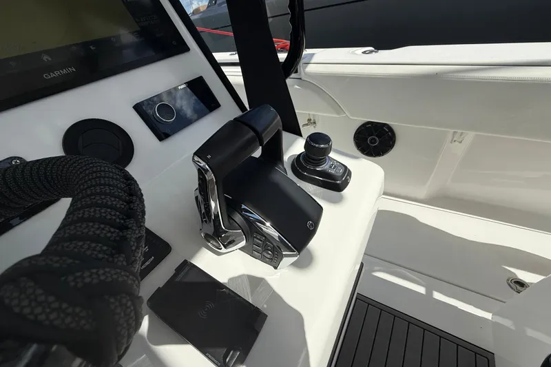 Slide: The Image of Control panel of 2024 SeaHunter 35 Tournament boat with advanced navigation equipment. - 8