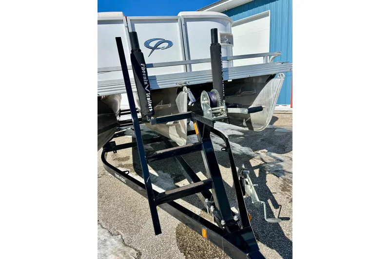 Slide: The Image of 2007 Crest LE 2270 pontoon boat on a trailer, parked outdoors. - 12
