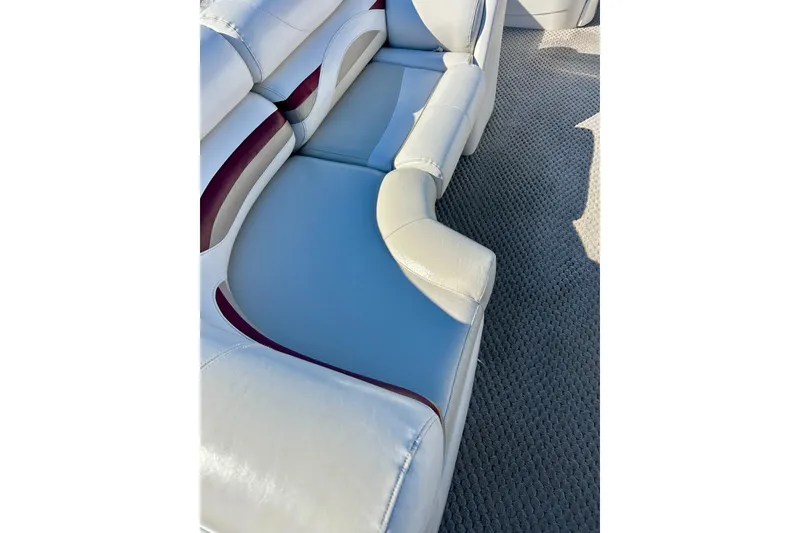 Slide: The Image of 2007 Crest LE 2270 boat interior seating with white and maroon upholstery. - 15