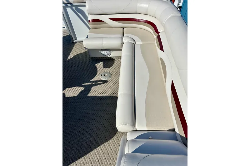 Slide: The Image of 2007 Crest LE 2270 boat interior with white and red cushioned seating. - 17