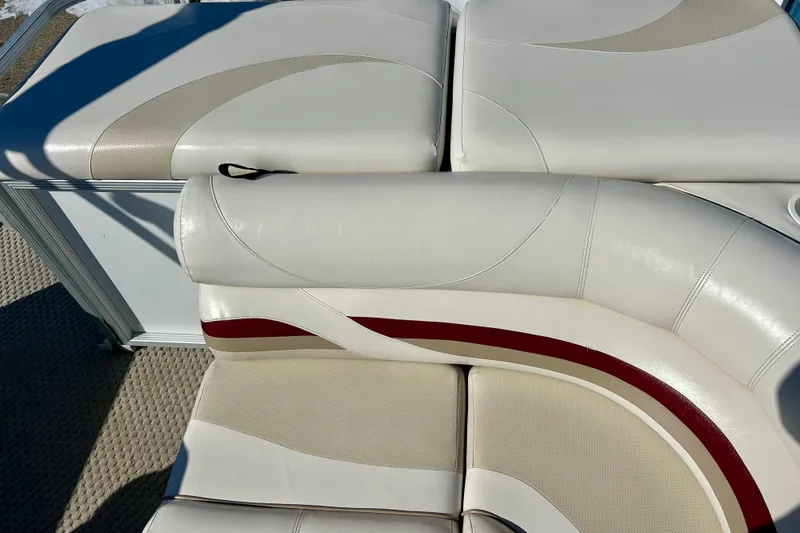 Slide: The Image of Luxurious seating on 2007 Crest LE 2270 boat with beige and red accents. - 18