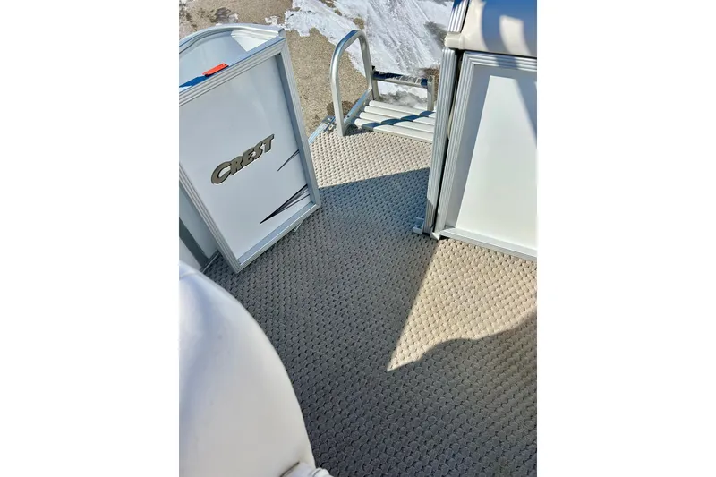 Slide: The Image of 2007 Crest LE 2270 boat interior with open door and textured flooring. - 19