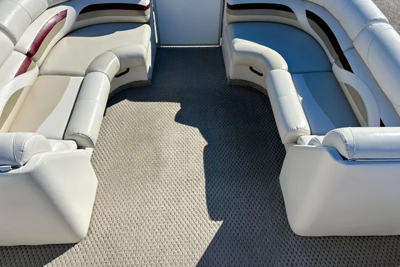 Slide: The Image of 2007 Crest LE 2270 boat interior with white and maroon seating, beige carpet. - 20