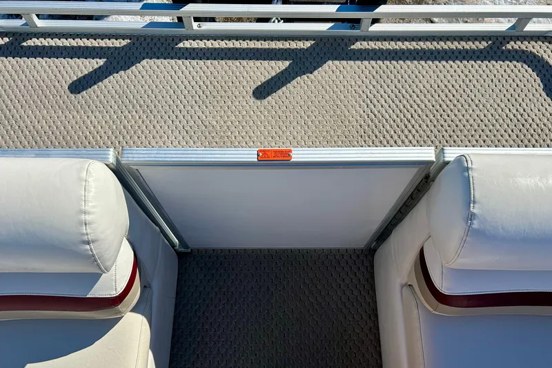 Slide: The Image of 2007 Crest LE 2270 boat interior with white seating and textured flooring. - 21