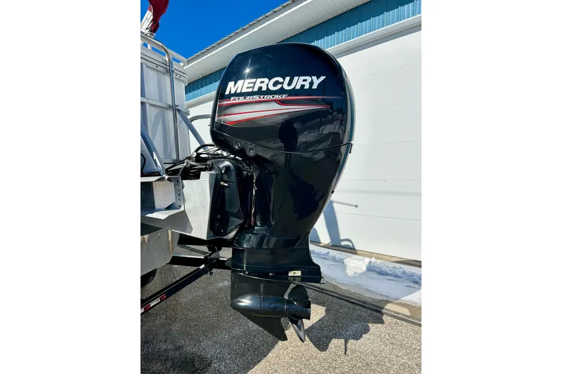 Slide: The Image of Mercury FourStroke outboard motor on 2007 Crest LE 2270 boat, parked outdoors. - 25