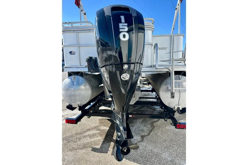 Slide: The Image of Rear view of a 2007 Crest LE 2270 pontoon boat with a 150 HP outboard motor. - 26