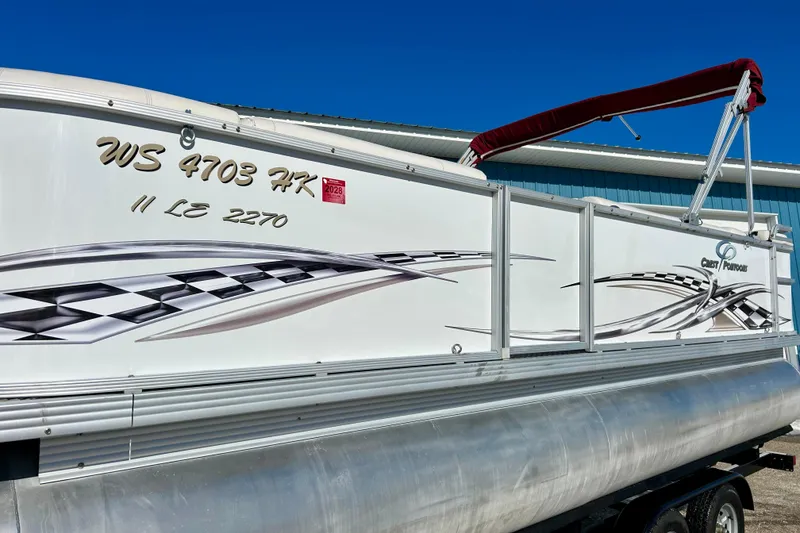 Slide: The Image of 2007 Crest LE 2270 pontoon boat with decorative graphics and red canopy. - 3