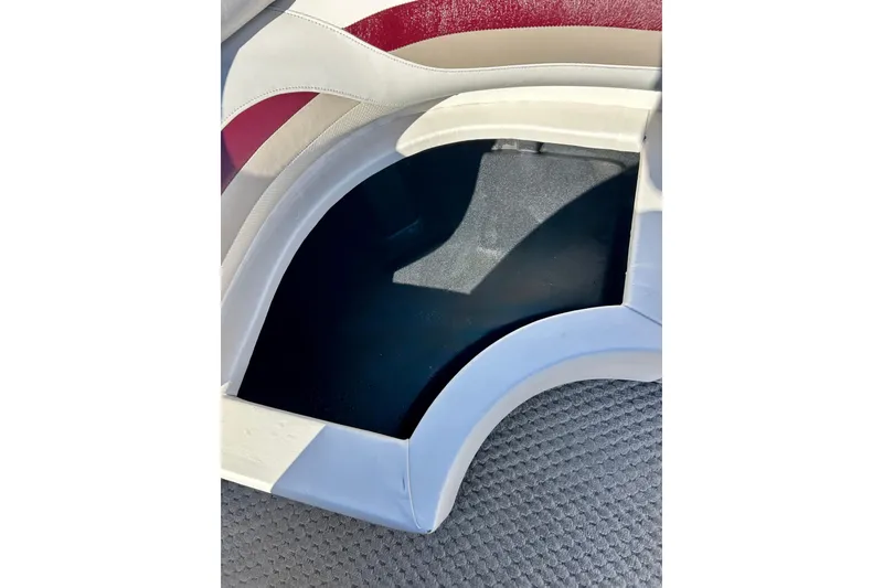 Slide: The Image of Interior storage compartment of 2007 Crest LE 2270 boat with cushioned seating. - 32