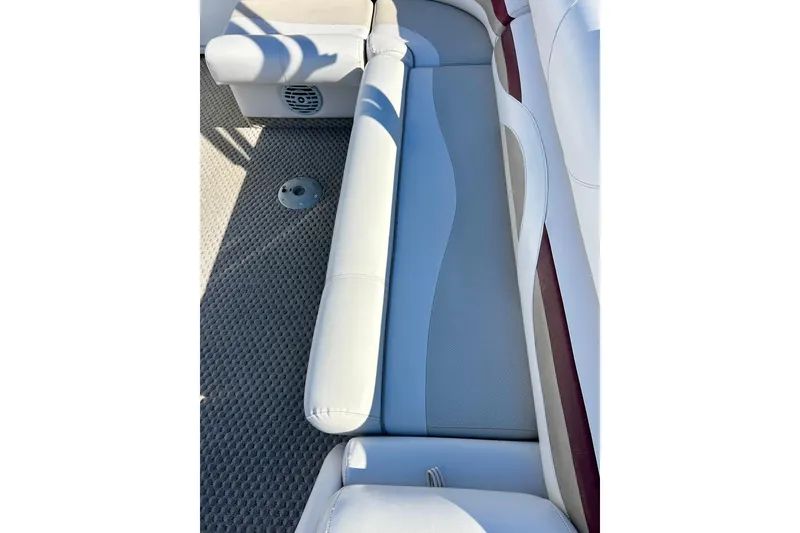 Slide: The Image of 2007 Crest LE 2270 boat interior with cushioned seating and carpeted floor. - 37