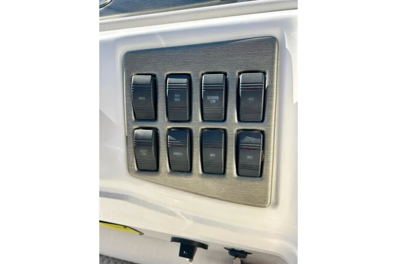 Slide: The Image of Control panel of a 2007 Crest LE 2270 boat with labeled switches. - 43