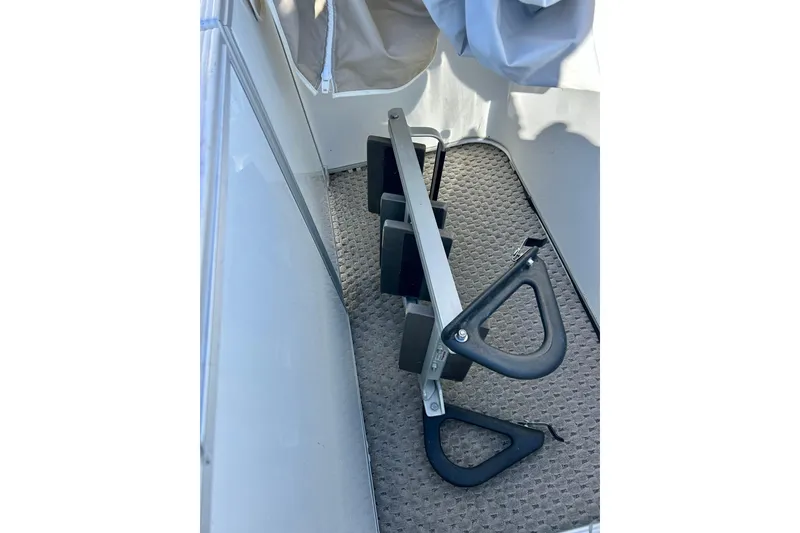 Slide: The Image of 2007 Crest LE 2270 boat interior with folded ladder on carpeted floor. - 47