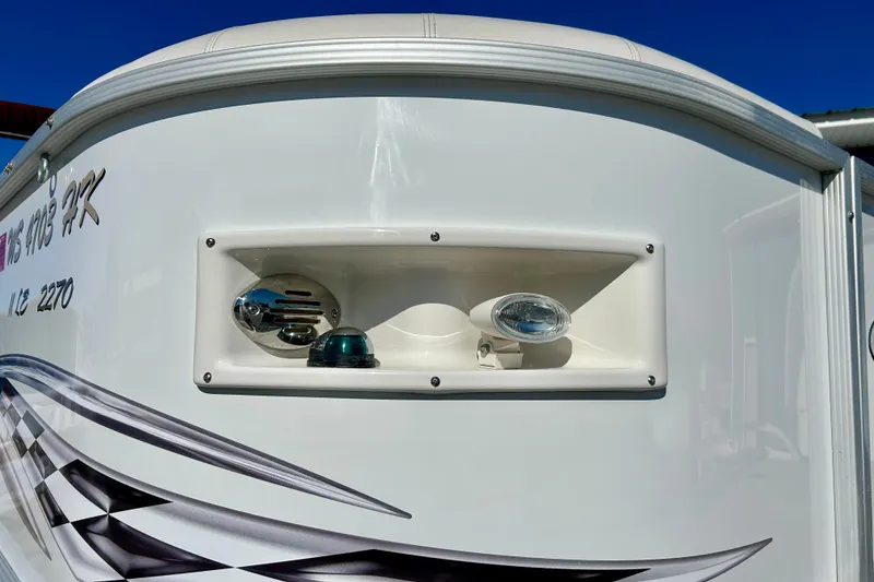 Slide: The Image of 2007 Crest LE 2270 boat with sleek design and modern lighting features. - 5