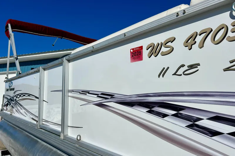 Slide: The Image of 2007 Crest LE 2270 pontoon boat with Wisconsin registration sticker, side view. - 6