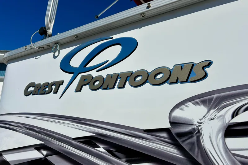 Slide: The Image of Crest Pontoons logo on 2007 Crest LE 2270 boat, featuring sleek design elements. - 7
