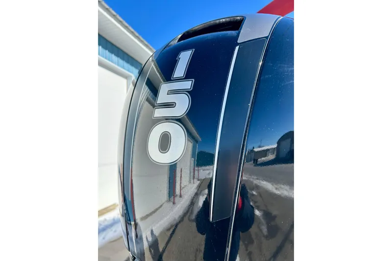 Slide: The Image of Close-up of a 2007 Crest LE 2270 outboard motor with "150" marking. - 9