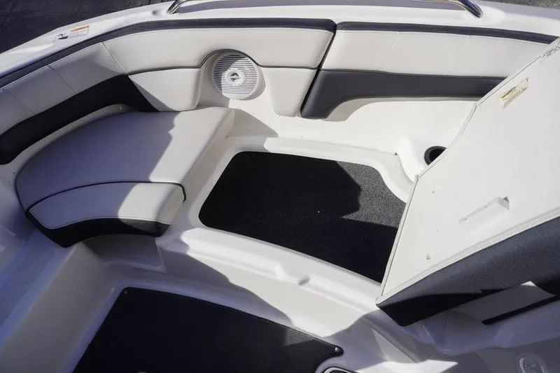 Slide: The Image of 2015 Yamaha Boats SX210 interior seating with speaker and storage compartment. - 10