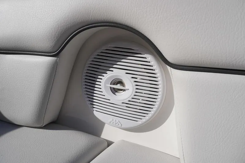 Slide: The Image of 2015 Yamaha Boats SX210 interior speaker detail with white upholstery. - 11