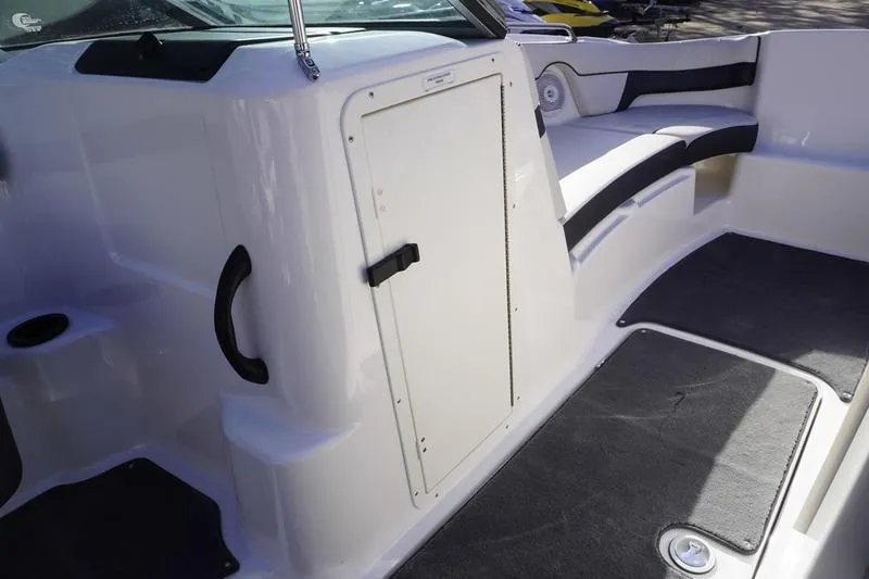 Slide: The Image of 2015 Yamaha Boats SX210 interior with seating and storage compartment. - 12