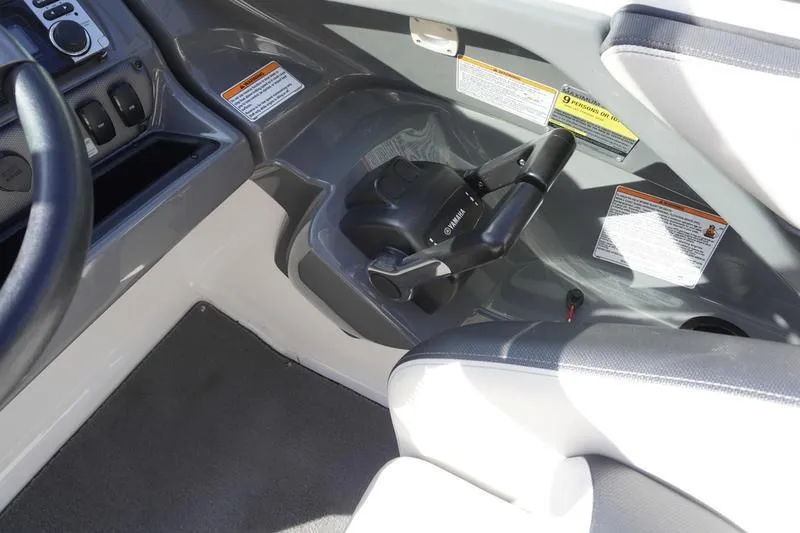 Slide: The Image of 2015 Yamaha Boats SX210 interior cockpit with steering and control panel. - 20
