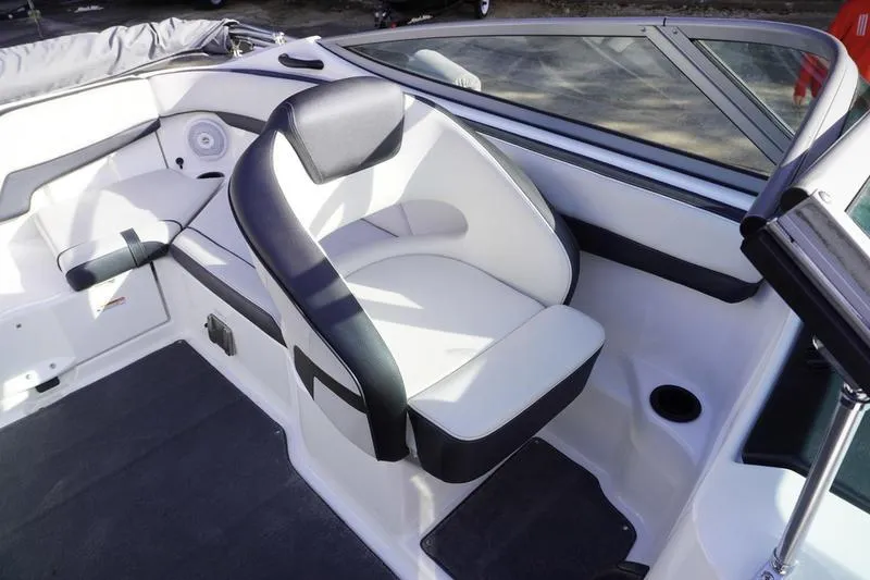Slide: The Image of 2015 Yamaha Boats SX210 interior with white and black seating, modern design. - 22