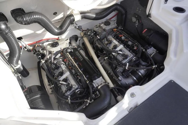 Slide: The Image of Engine compartment of a 2015 Yamaha Boats SX210, showcasing dual engines and components. - 26