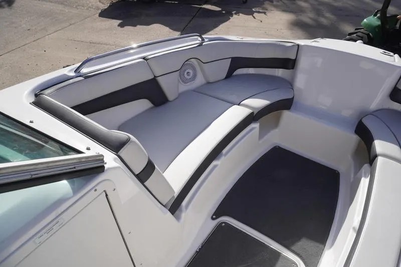 Slide: The Image of 2015 Yamaha Boats SX210 interior with cushioned seating and speaker system. - 6