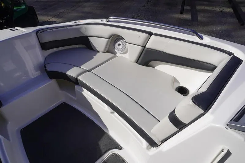 Slide: The Image of 2015 Yamaha Boats SX210 interior seating with sleek, modern design and comfortable upholstery. - 9