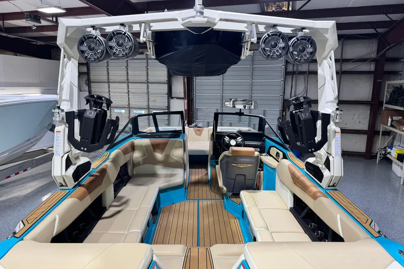 Slide: The Image of 2023 Nautique Super Air Nautique S23 interior with premium seating and advanced sound system. - 16