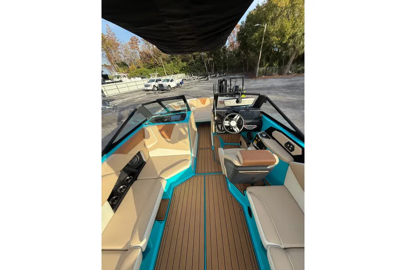 Slide: The Image of 2023 Nautique Super Air Nautique S23 boat interior with luxurious seating and modern design. - 7