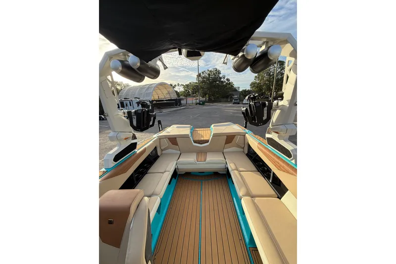 Slide: The Image of 2023 Nautique Super Air Nautique S23 interior with luxurious seating and modern design. - 9