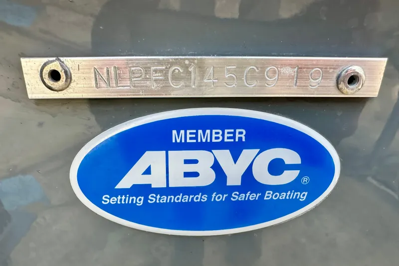 Slide: The Image of 2019 Tidewater 252 CC Adventure boat cruising on sparkling water. - 13