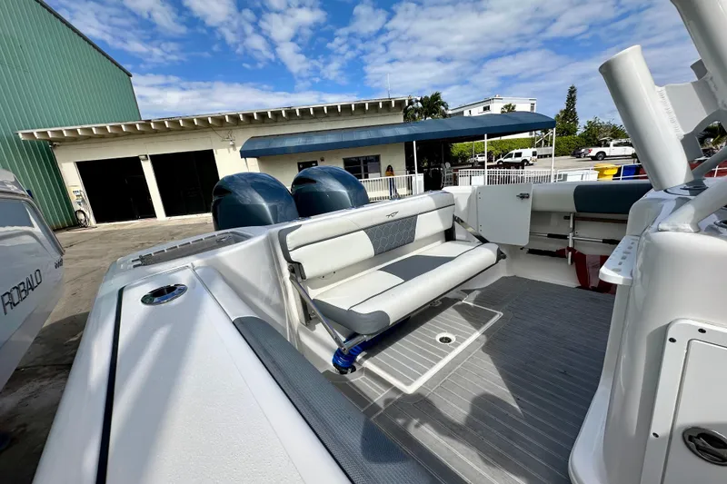 Slide: The Image of Aerial view of 2019 Tidewater 252 CC Adventure boat cruising on open water. - 15