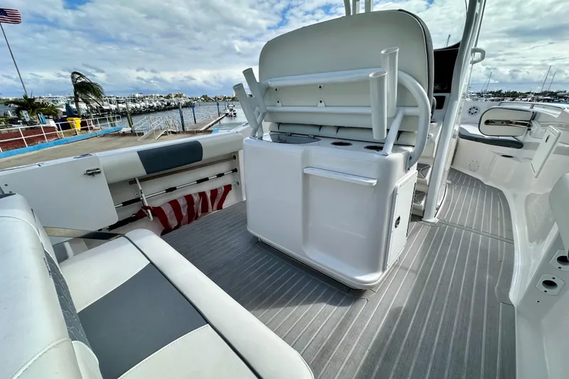 Slide: The Image of 2019 Tidewater 252 CC Adventure boat cruising on open water, aerial view. - 16