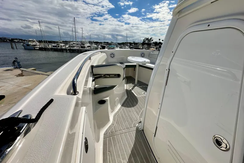 Slide: The Image of 2019 Tidewater 252 CC Adventure boat with dual engines and seating area. - 31