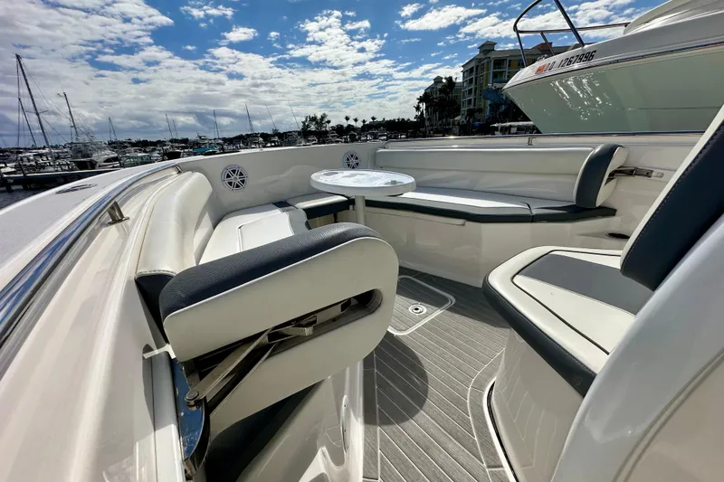 Slide: The Image of Livewell compartment on a 2019 Tidewater 252 CC Adventure boat, featuring a blue interior. - 34