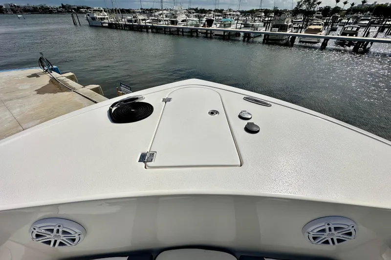 Slide: The Image of 2019 Tidewater 252 CC Adventure boat helm with steering wheel and controls. - 40